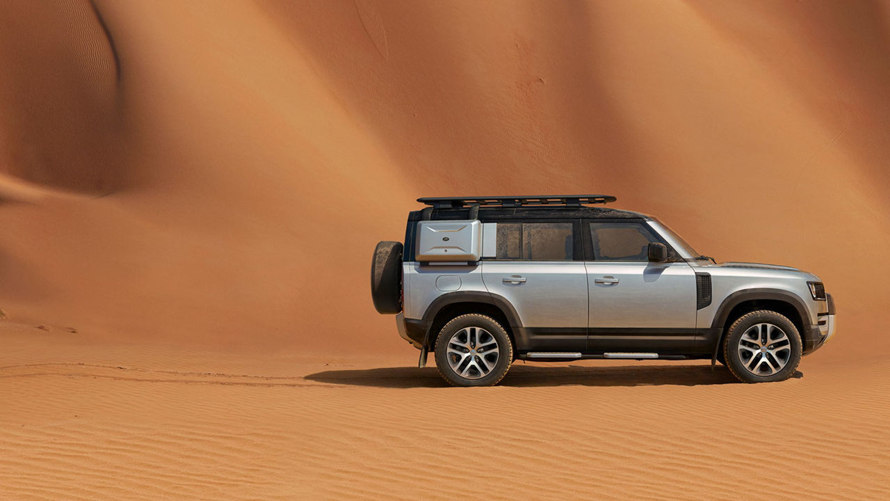Land Rover Defender in desert background