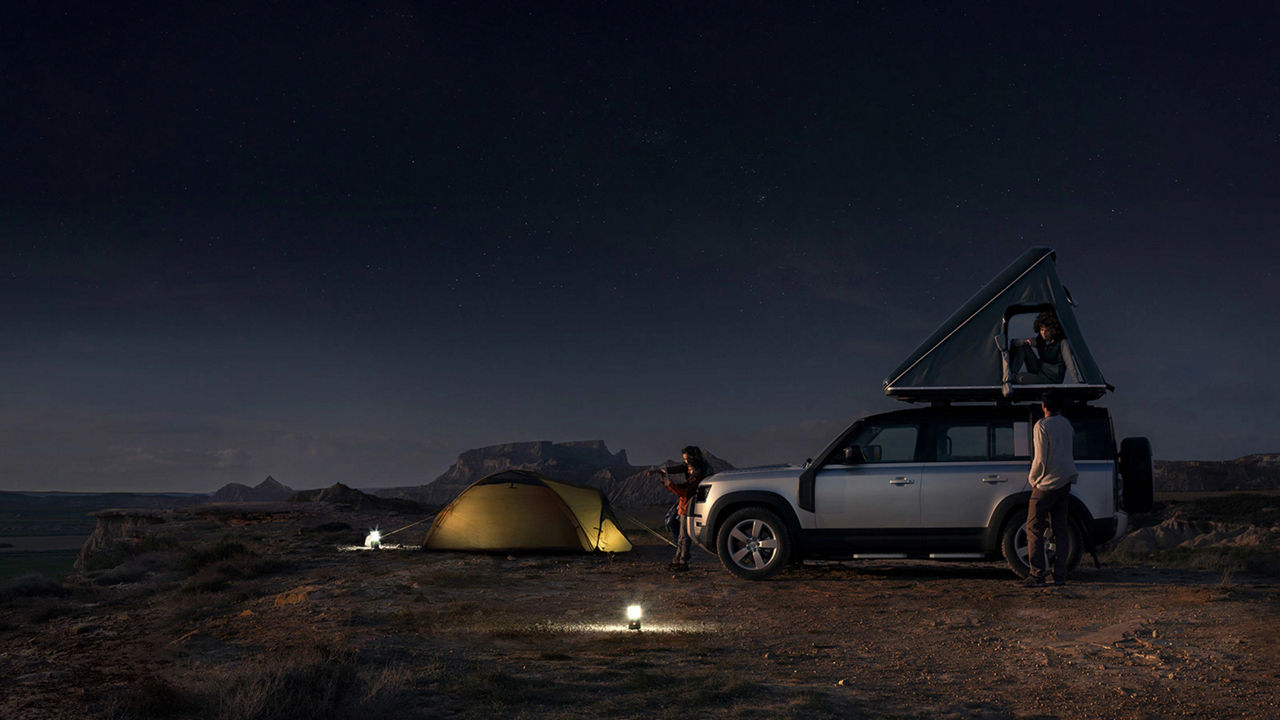 Land Rover Defender camping night scenery
