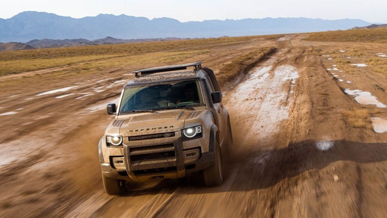 Land Rover Defender driving in mud