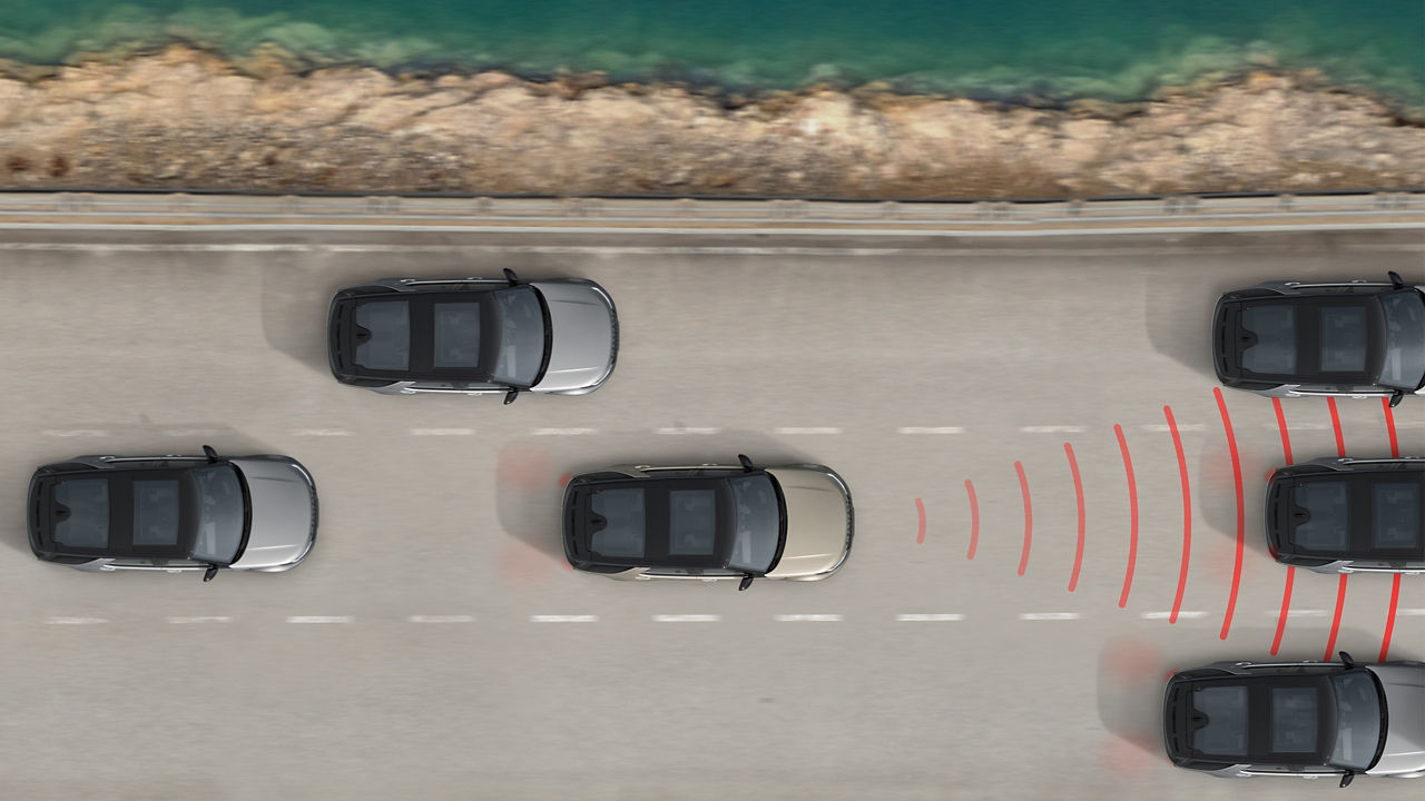 Birds eye view of Discovery's on the road one of which showing a red radar to cars in front