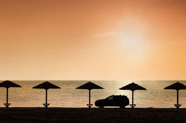 Land Rover Discovery driving on beach