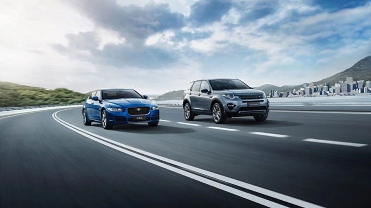 Land Rover and Jaguar Vehicles driving down the road 