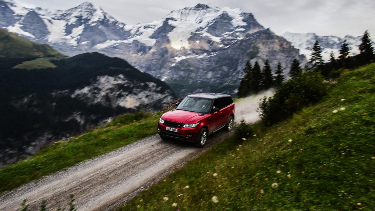 Range Rover driving in Switzerland landscape