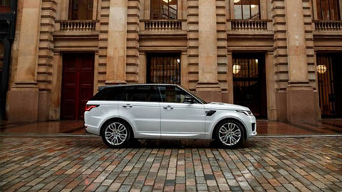 White Range Rover Sport near the building 