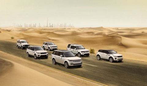 Land Rover different models driving desert landscape