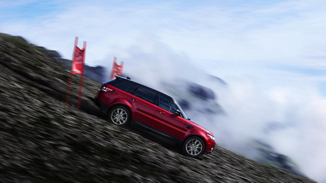 Range Rover driving a hill