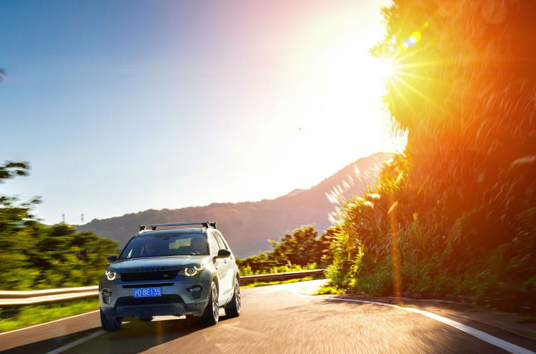 Land Rover Discovery driving on road