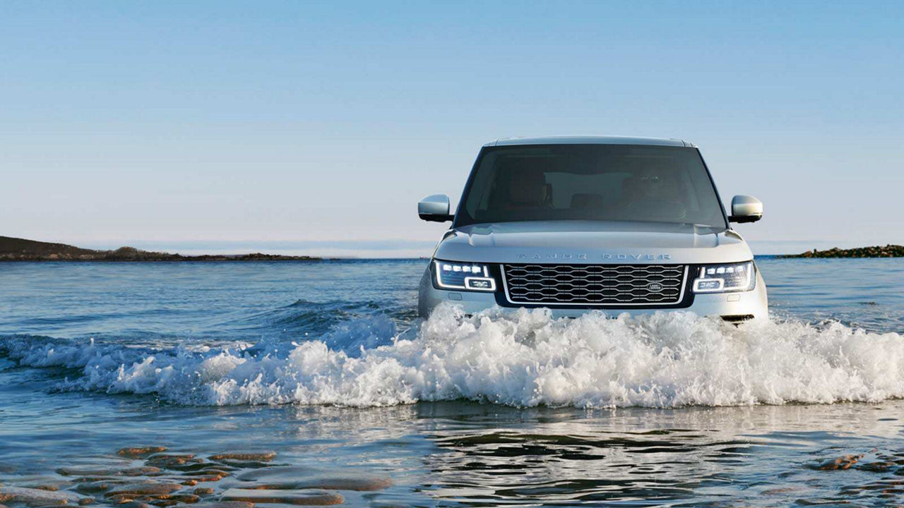 Range Rover driving through water