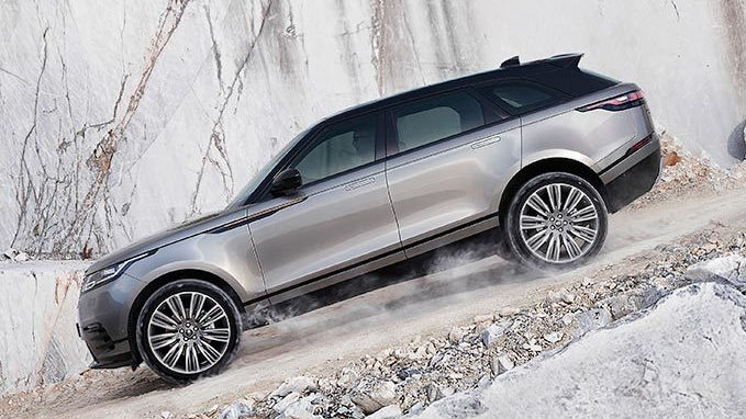 Range Rover is driving down a hill