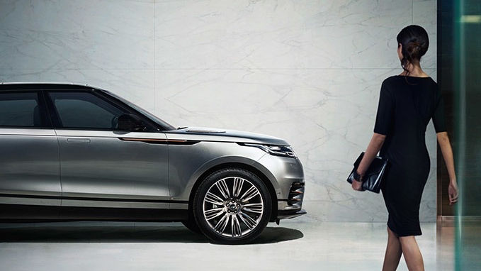 Range Rover parked and a human being is getting closer to it