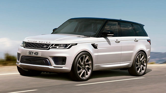 White Land Rover Vehicle driving on a road