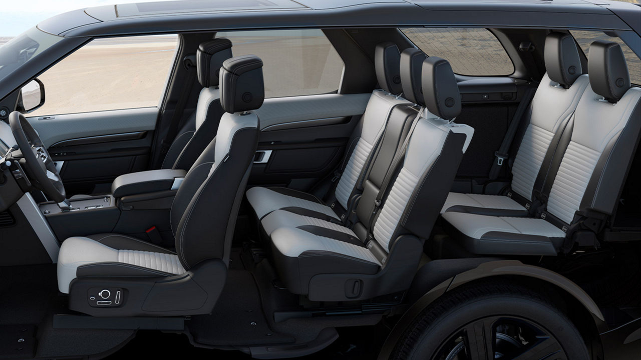 Land Rover Defender black and white interior with seven seats