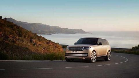 The New Range Rover driving round a corner