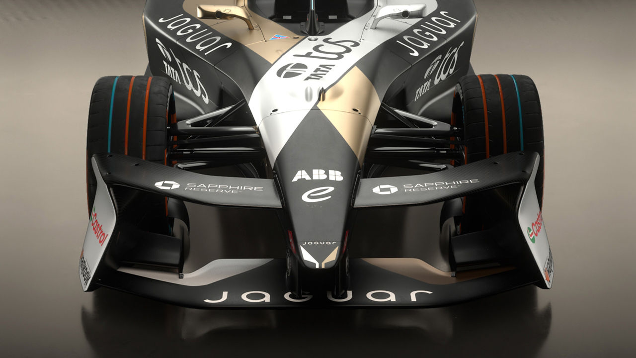 Front view of a Jaguar racing car showing front wing, and sponsor logos.