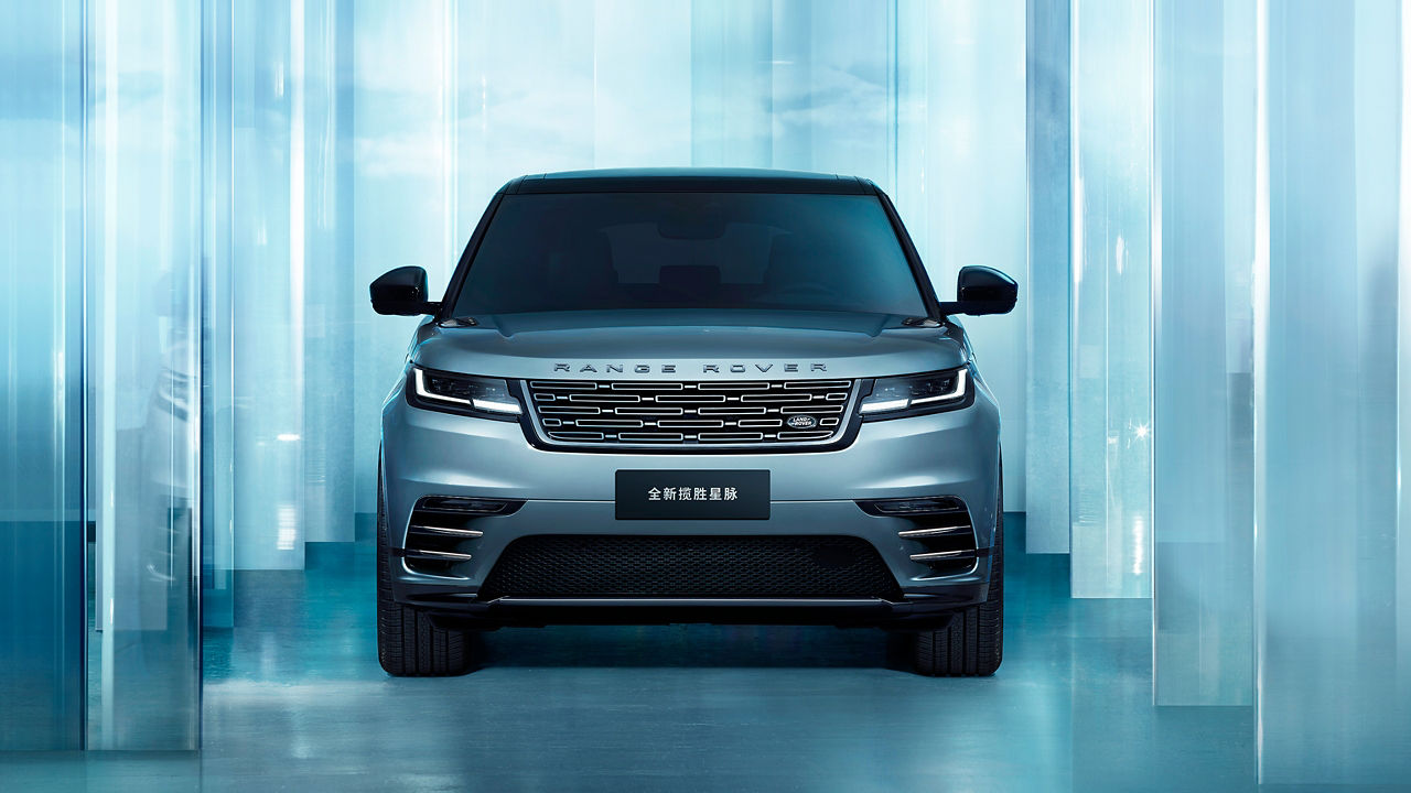 Front view of the Range Rover Velar with glass background