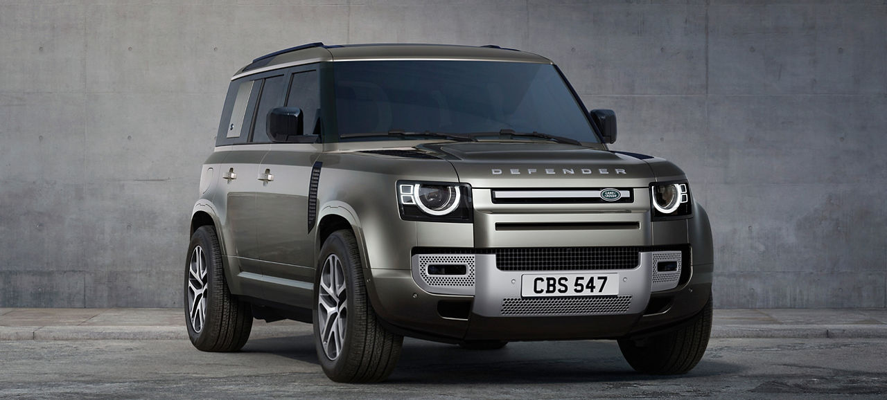 Defender standing on grey textured background