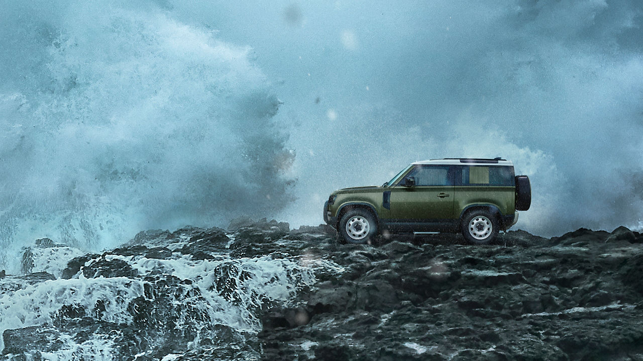 Defender on Mountain surrounded with water