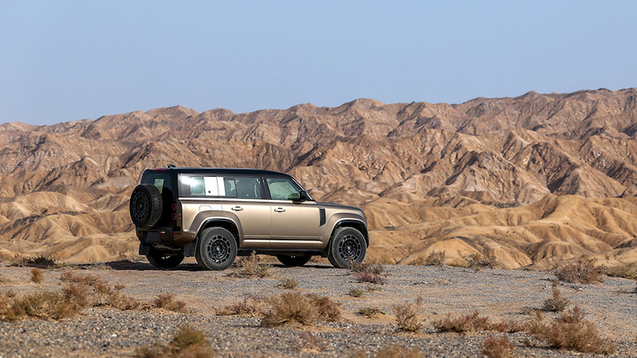 Defender surrounded by hills