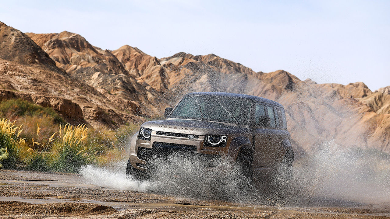 Defender driving in lake