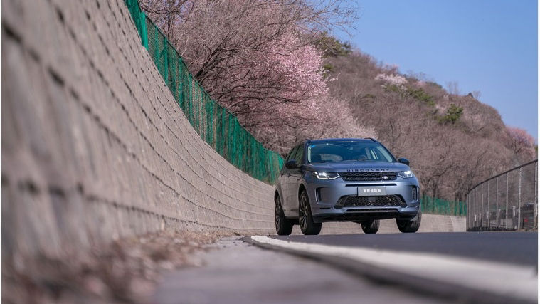 Land Rover Vehicle driving on the road