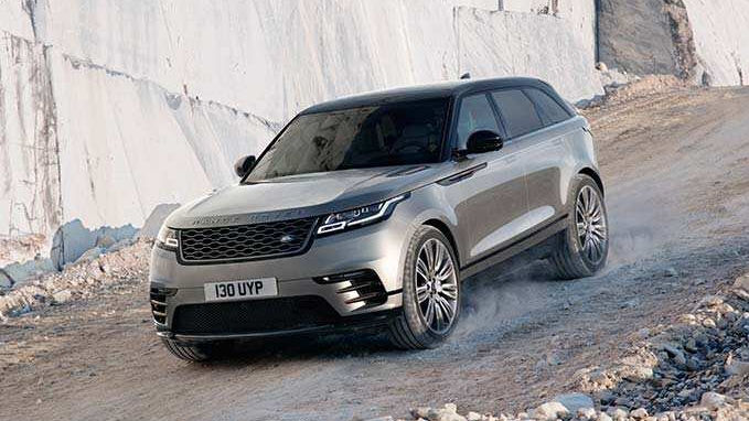 Range Rover driving down hill
