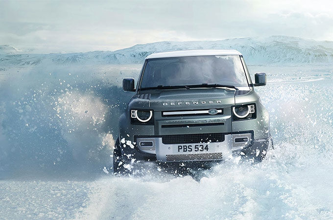 Land Rover Defender driving through water