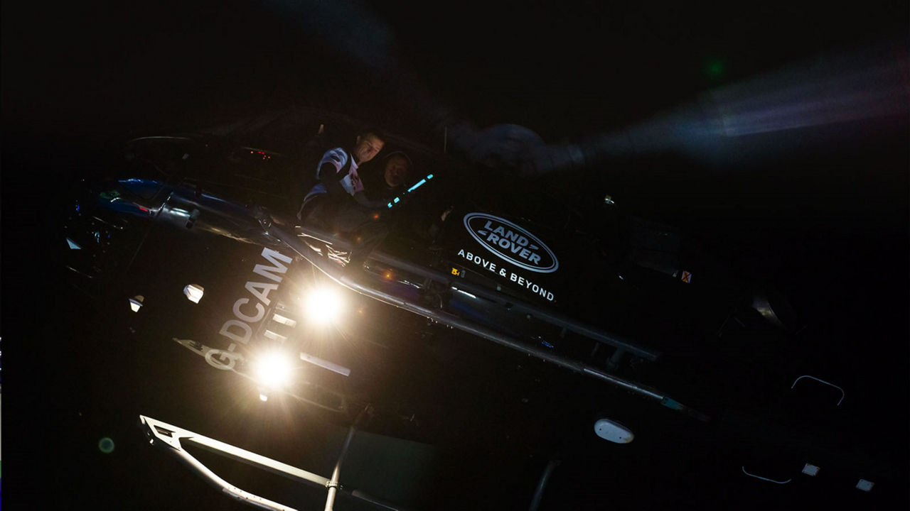 Land Rover branded helicopter in flight