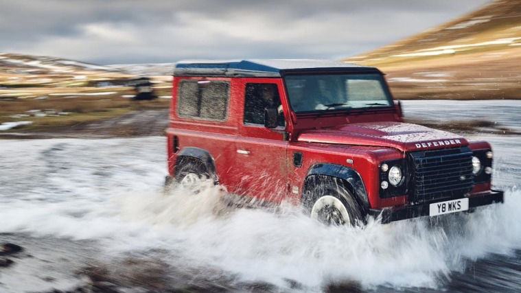 Land Rover Defender V8 off-roading through water