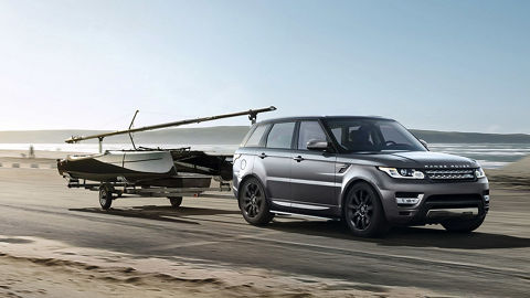 Range Rover pulling boat trailer