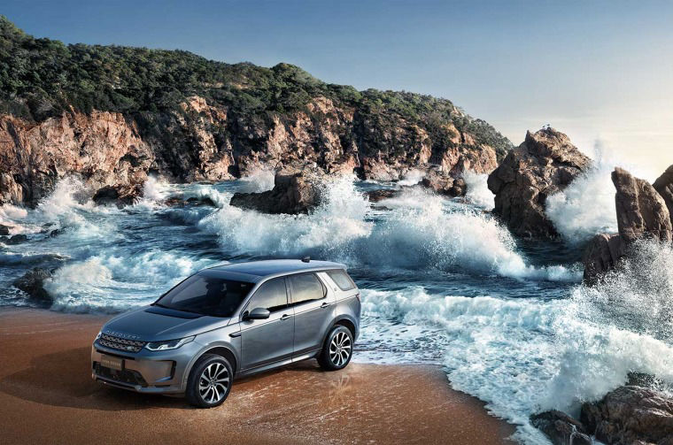Land Rover DIscovery parked on beach 