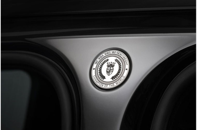 Joshua's four world heavyweight titles and his family crest engraved on a special logo