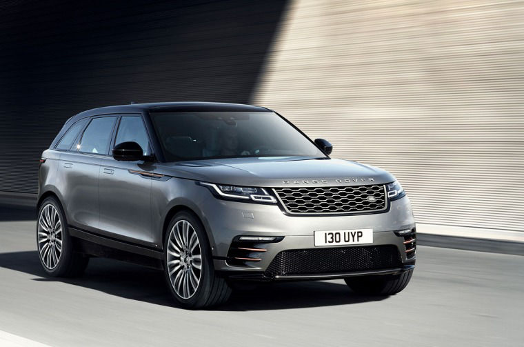 Range Rover driving on road