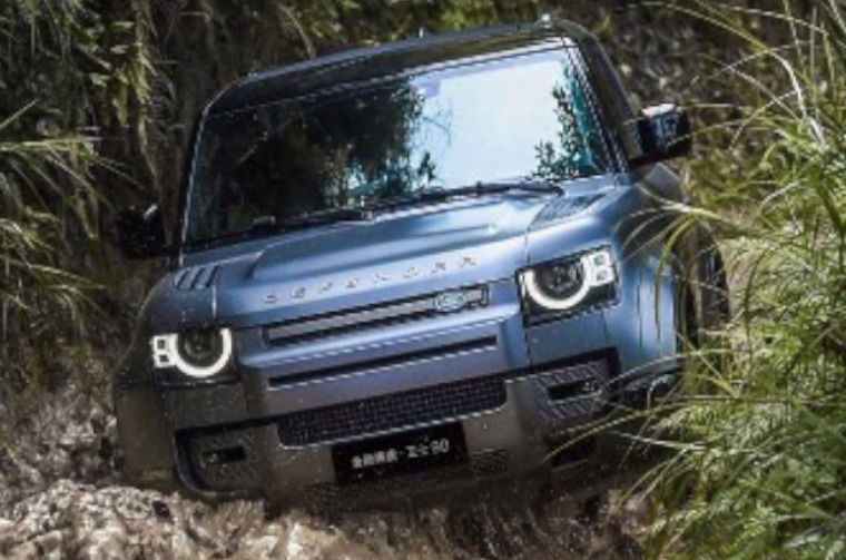 Land Rover Defender driving through water
