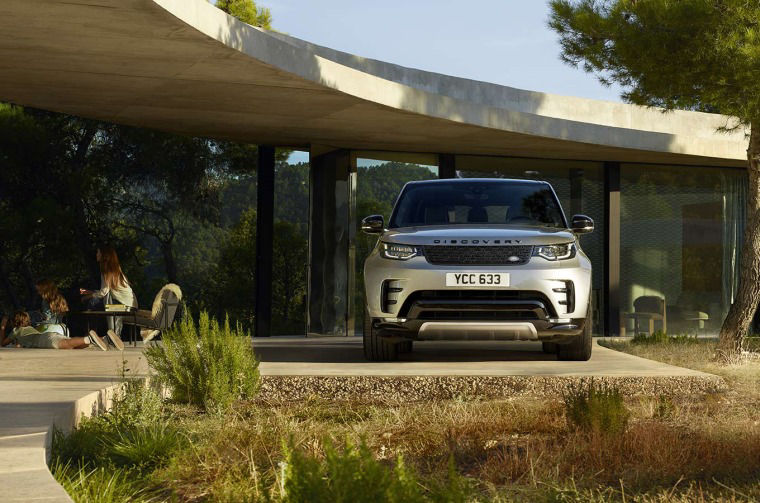 Land Rover Discovery parked outside house 