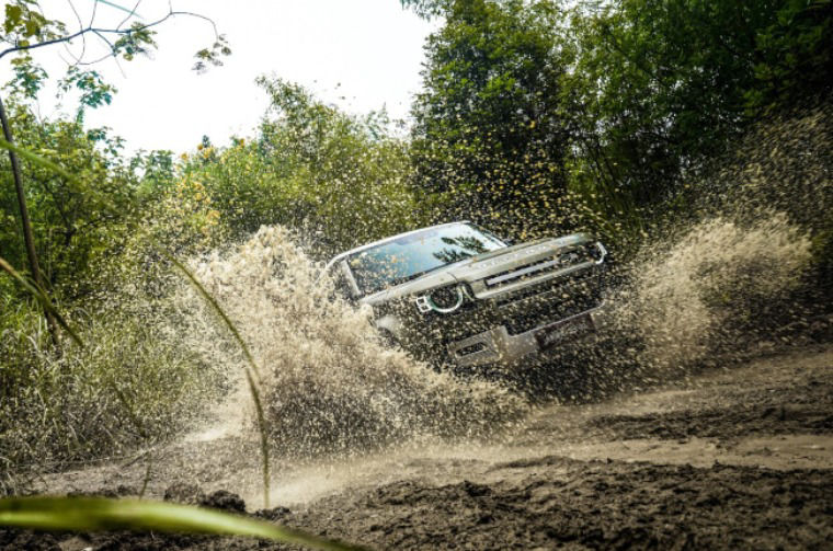 Land Rover Defender driving through water