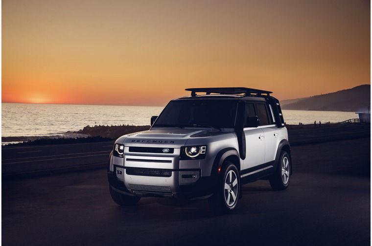 Land Rover Defender parked by beach