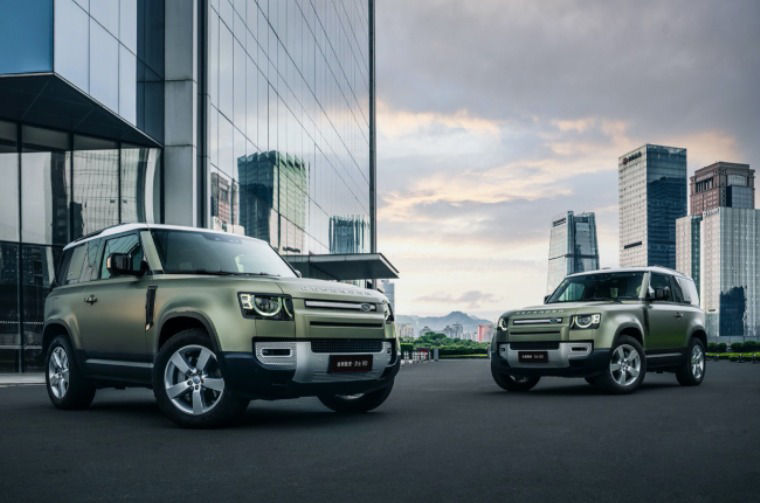 Land Rover Defenders parked in city