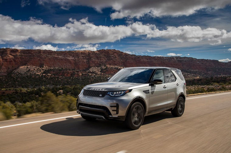 Land Rover Discovery driving on mountain motorway