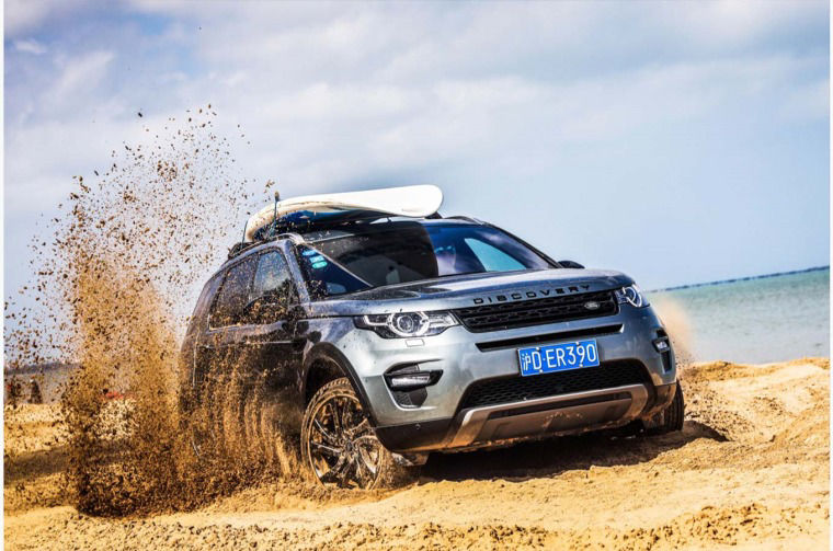 Land Rover Discovery driving on beach