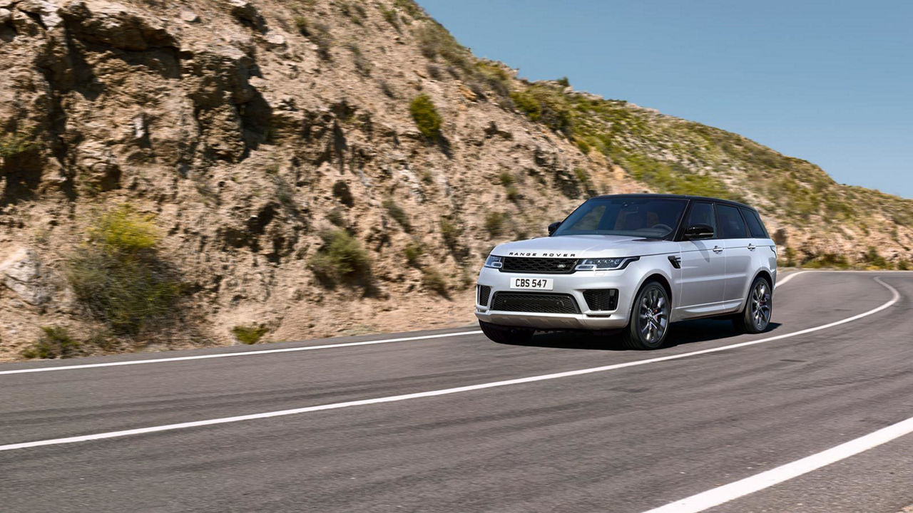 Range Rover driving on mountain road