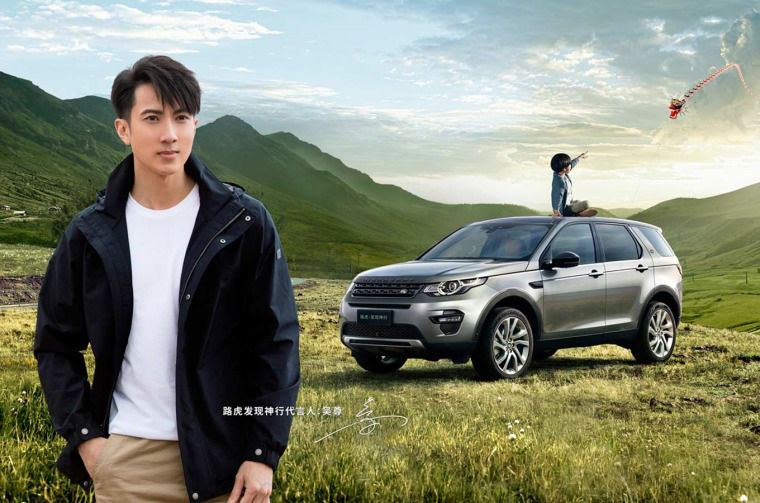 Man with Land Rover Discovery in  background