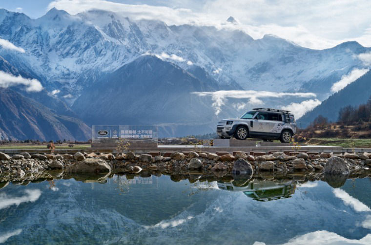 Land Rover Defender in mountain landscape