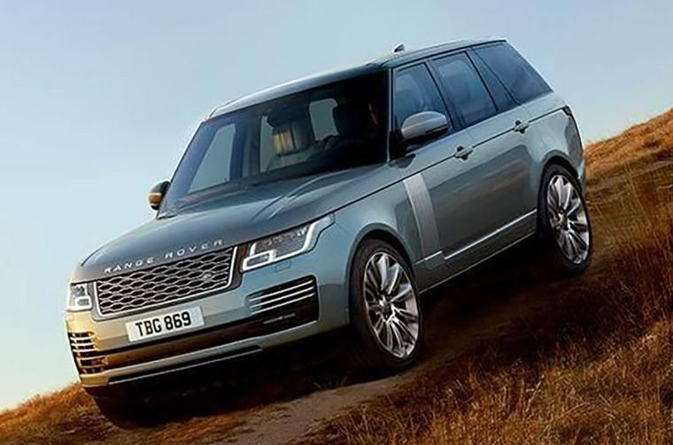 Range Rover driving down a hill