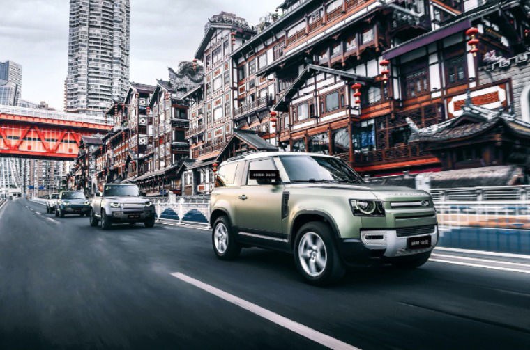 Land Rover Defender driving through city