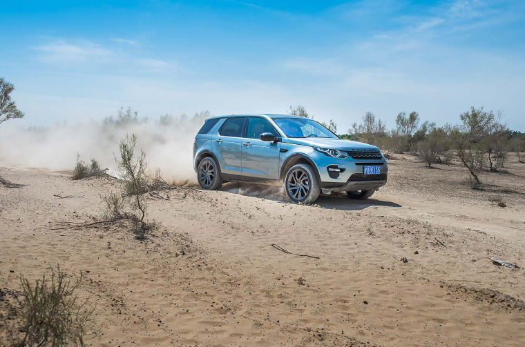 Land Rover Discovery Sport driving through desert