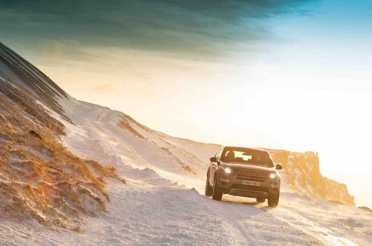 Range Rover driving down a hill