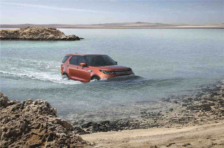 Land Rover Discovery driving through water