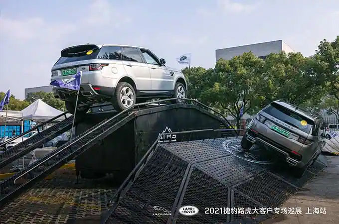 Land Rover vehicles driving on ramps
