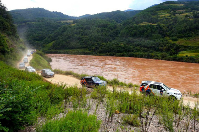 Land Rover vehicles driving on dirt road