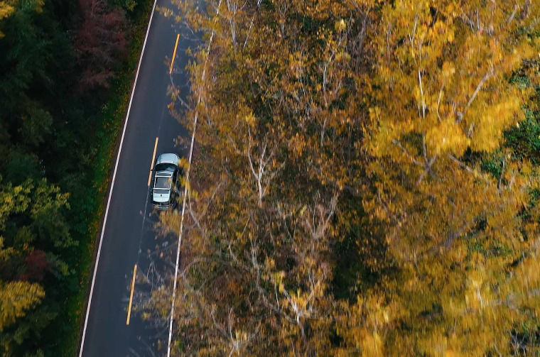 Aerial view of Land Rover Discovery on road